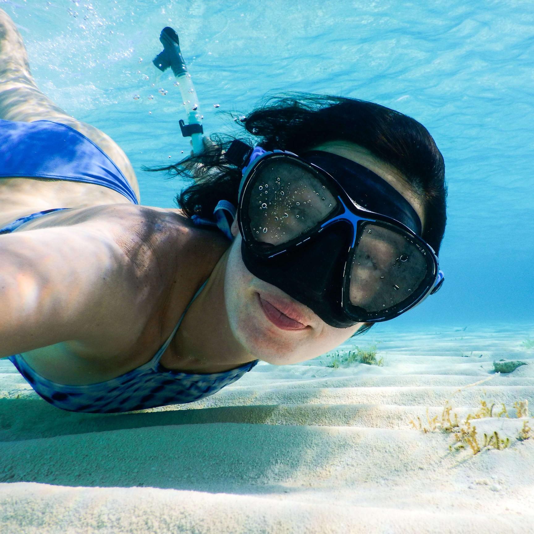 Woman diving in the ocean